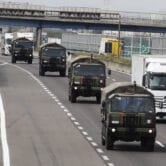 Military trucks carry dead Covid-19 victims in Italy.