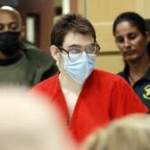 Nikolas Cruz, wearing a face mask, enters a courtroom in Florida.