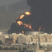 A cloud of smoke rises from a burning oil depot in Jiddah, Saudi Arabia.