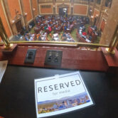 A table reserved for the media above the floor of the Utah House of Representatives.