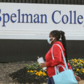 A woman walks outside of the campus of Spelman College in Georgia.