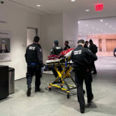 Medical personnel help a stabbing victim at MoMA in New York City.