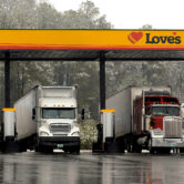 Tractor-trailer rigs refuel at a gas station in Georgia.