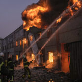 A warehouse burns after a bombing in Kyiv, Ukraine