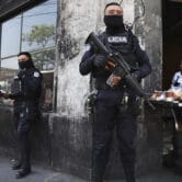 Heavily armed police guard the streets in downtown San Salvador, El Salvador.