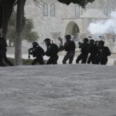 Israeli police clash with Palestinian protesters at the Al-Aqsa Mosque compound.