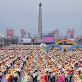 People dance in the celebration of the birth anniversary of late state founder Kim Il Sung.
