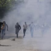 Israeli border police use teargas to disperse Palestinian protesters in the West Bank.
