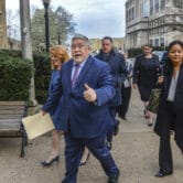 Patrick Morrisey gives the thumbs up before entering a courthouse in West Virginia.
