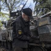 A soldier repairs a tank in eastern Ukraine