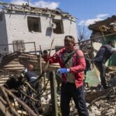 Debris is removed from destroyed houses in Zaporizhzhia, Ukraine
