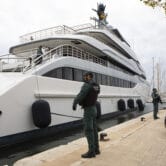 Spanish Civil Guards stand by a yacht owned by Russian oligarch Viktor Vekselberg.