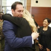 William Husel hugs his wife after being found not guilty in a courthouse in Ohio.