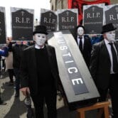 Demonstrators protest outside Hillsborough Castle ahead of a visit by Boris Johnson.