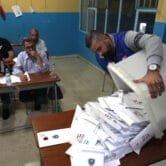 Election officials count ballots shortly after the polling stations closed in Tripoli, Lebanon.