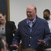 Mario Batali reacts after being found not guilty during his trial in Boston.