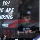 A now-hiring sign at a restaurant outside Chicago
