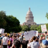 Protesters demonstrate outside the Texas Capitol