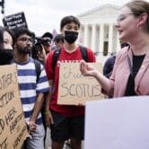 Demonstrators face off over abortion at the Supreme Court.