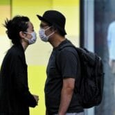 A couple kisses near a Covid-19 testing facility in Beijing