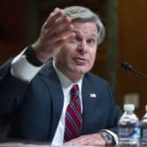 Christopher Wray testifies before a Senate subcommittee in Washington.