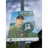 Election poster with a solider on it
