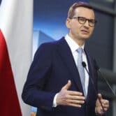 Mateusz Morawiecki briefs the media during a joint news conference.