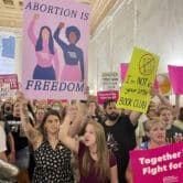 Abortion rights protesters chant outside of the West Virginia Senate chambers.