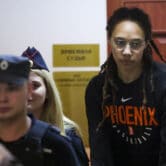 Brittney Griner is escorted to a Russian courtroom for a hearing.