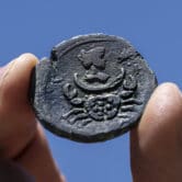 A nearly 1,850-year-old bronze coin discovered off the coast of Israel.