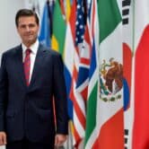 Enrique Peña Nieto next to flags