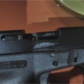 a close up photo shows the serial number of a Glock 9mm pistol