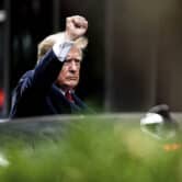 Donald Trump gestures as departs Trump Tower in New York.