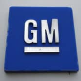 A General Motors logo is displayed outside an assembly plant in Michigan.