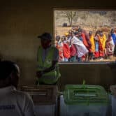 People wait to vote at a polling station in Kenya.