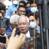 Najib Razak speaks to supporters outside a court in Malaysia.