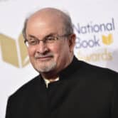 The author Salman Rushdie poses for a photo at an event in New York.