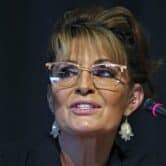 Sarah Palin in front of a microphone.