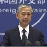 Wang Wenbin speaks during a daily briefing in Beijing.