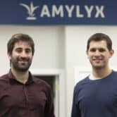 The co-founders of the pharmaceutical company Amylyx pose for a photo.