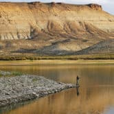 A man fishes in the Flaming Gorge Reservoir in Wyoming.