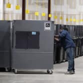 A worker returns voting machines to storage in Georgia.