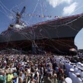 An Arleigh Burke-Class destroyer is christened in Maine.