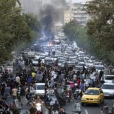 People chant slogans during a protest in downtown Tehran, Iran.