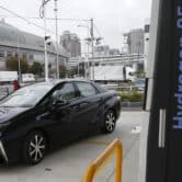 Toyota hydrogen fuel cell vehicle Mirai arrives at a charge station