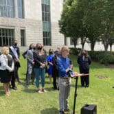 Dylan Brandt speaks at a news conference outside the federal courthouse in Little Rock.