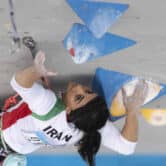 Iranian athlete Elnaz Rekabi competes during a climbing tournament.