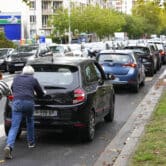 French people push car to gas station