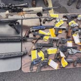 Some of the firearms that were surrendered to law enforcement at a gun buyback event.