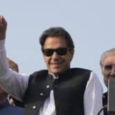 Imran Khan gestures to his supporters at a rally in Lahore, Pakistan.